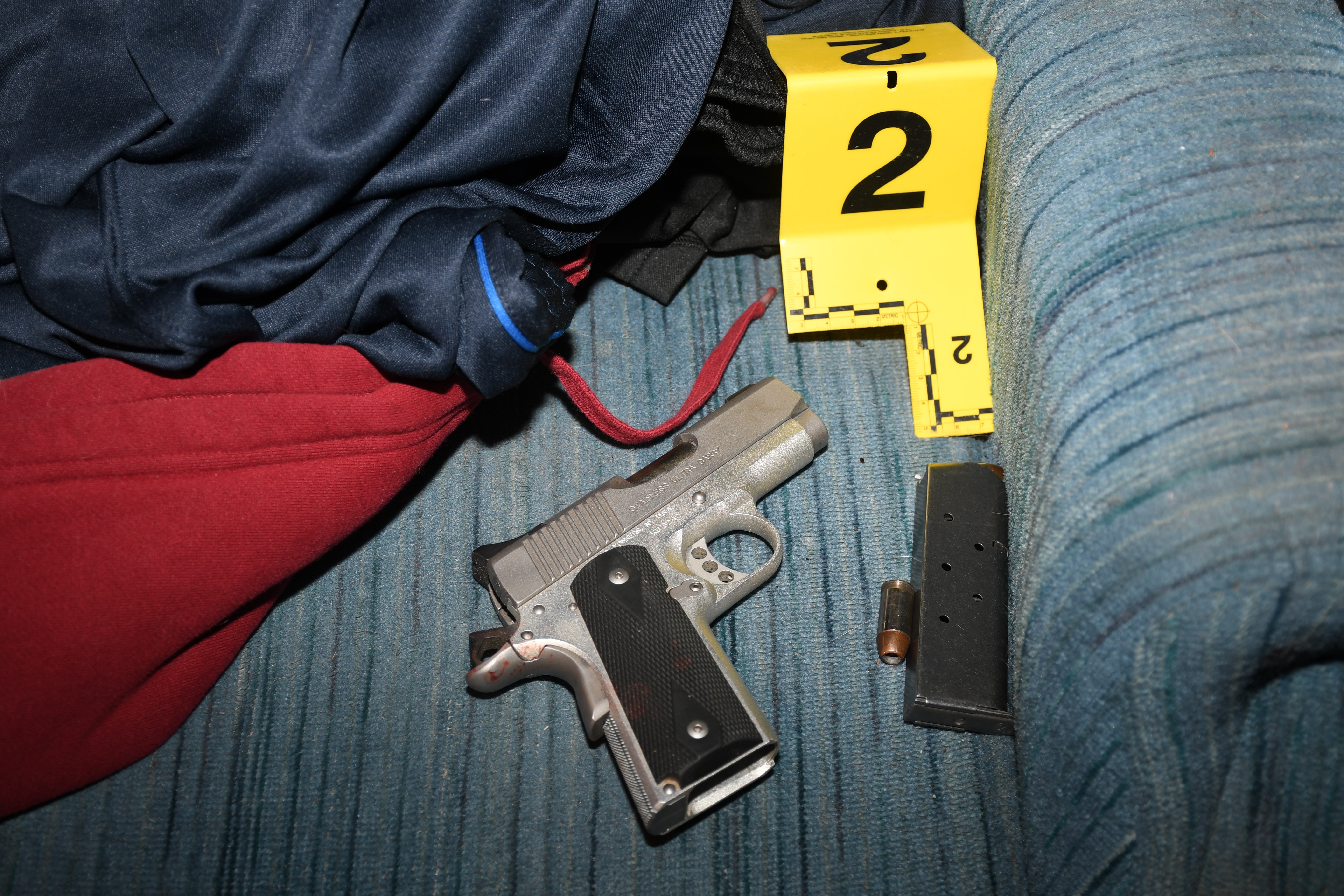 The firearm possessed by Edward R. Gendron, Jr.,  referenced by Officer Tompkins and Ms. Minicucci. 