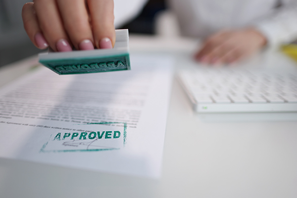 Document being stamped for approval