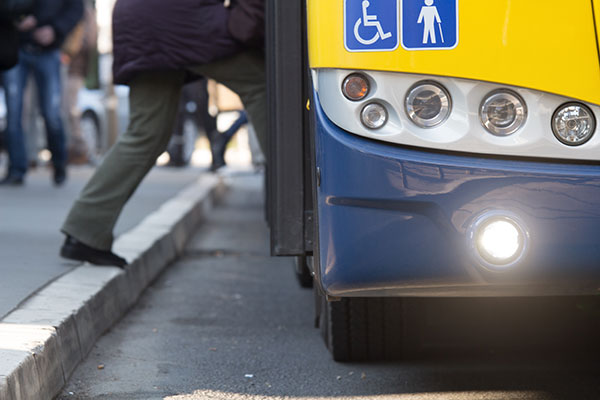 person getting on a bus