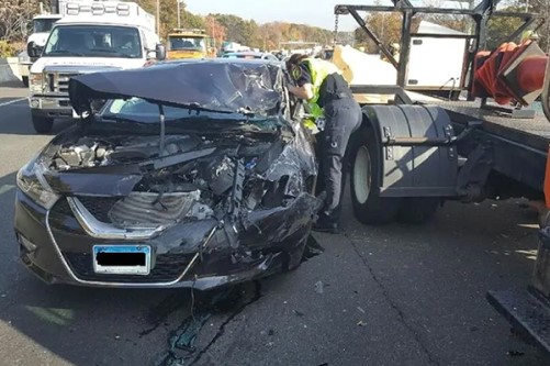 crashed black car in a work zone - work zone safety