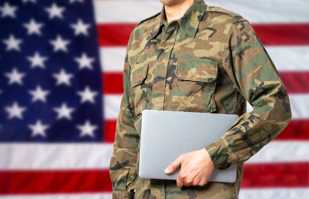 Veteran holding a laptop