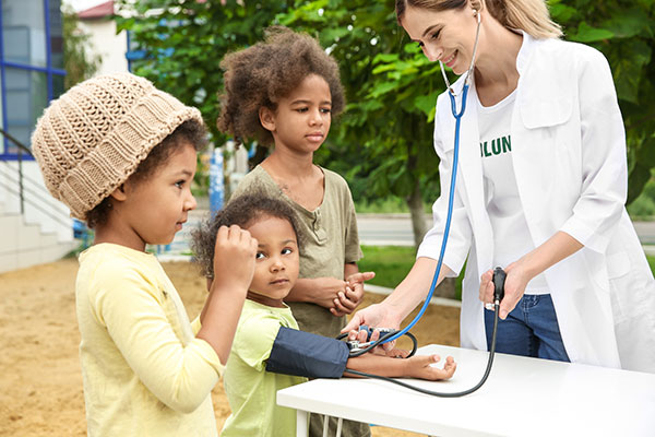 doctor treating children